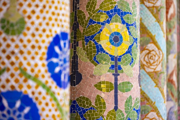 Columns with colourful mosaic on the outdoor terrace