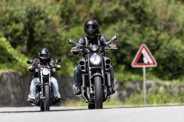 Motorbike on the winding Nufenen Pass in the Alps