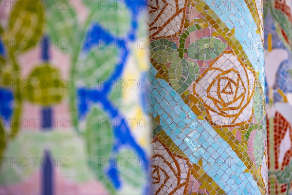 Columns with colourful mosaic on the outdoor terrace