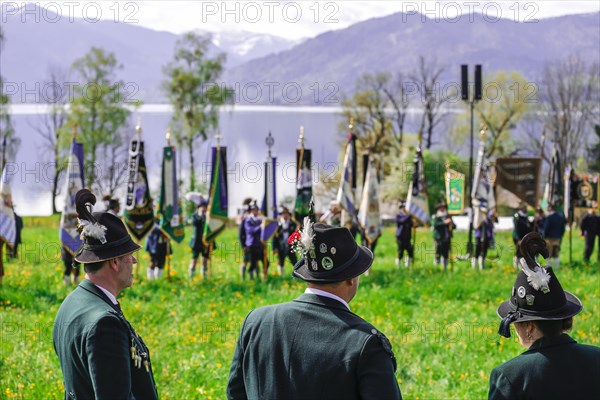 Mountain riflemen gather at the patron saint's day in a meadow near Gmund am Tegernsee