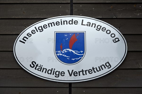 Sign of the Permanent Representation of the Island Municipality of Langeoog at the Ferry House in Bensersiel