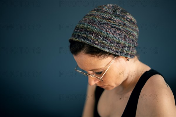 Woman with glasses and knitted cap