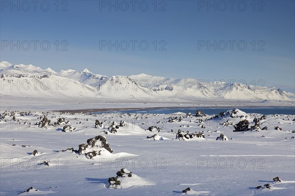 Lava field covered in snow at the Snaefellsjoekull National Park in winter on the Snaefellsnes peninsula in Iceland