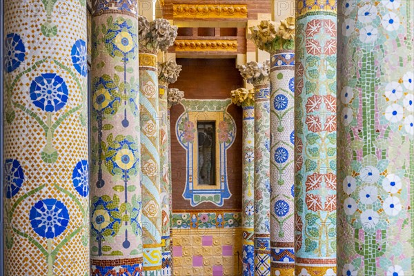 Columns with colourful mosaic on the outdoor terrace