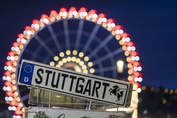 Colourfully illuminated Ferris wheel at Schlossplatz