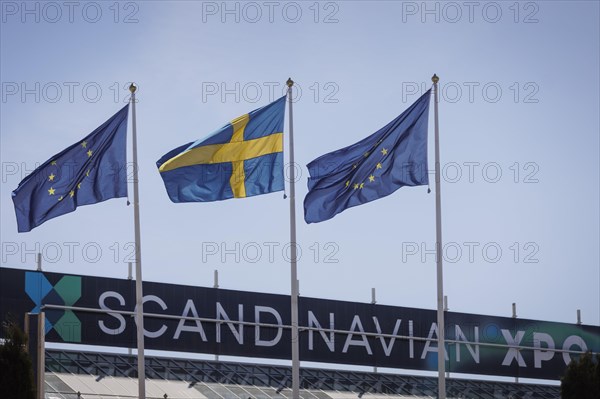 The Swedish flag as well as European flags flying in the wind at the Gymnich meeting in Stockholm