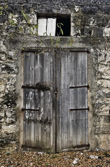 Abandoned and ecayed house with wooden doors in Byblos Lebanon Middle East