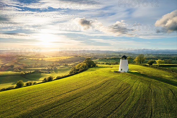 Sunnset over Devon Windmill over Fields and Farms