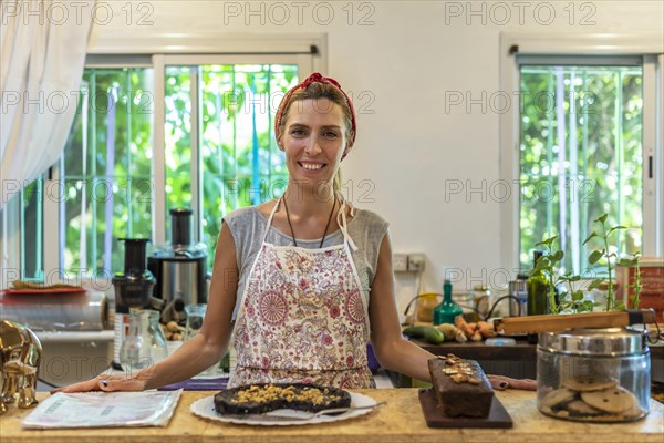 Business owner standing at the bar of her coffee and juice shop. Entrepreneur concept. Successful woman feeling confident