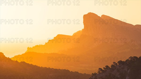 Orange sunset in mountains