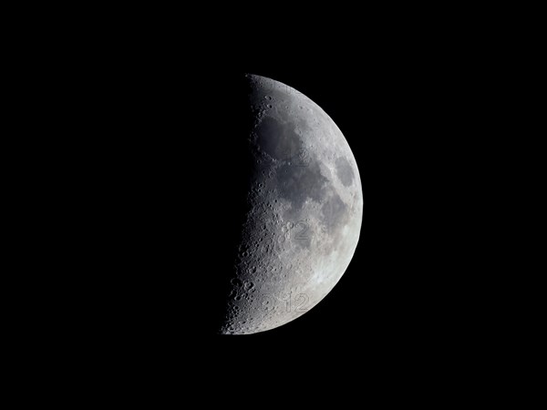 First quarter moon seen with an astronomical telescope