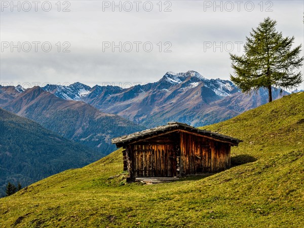 Hut on the mountain pasture in autumn with the Lasoerling