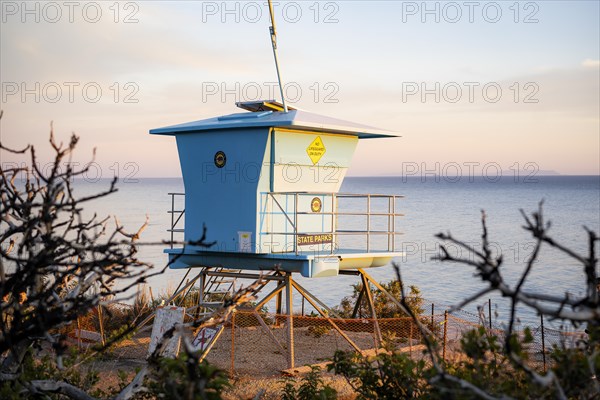 A lifeguard tower at sunset in El Matador Beach