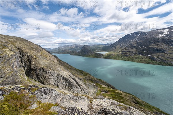 View of Lake Gjende behind Knutshoe Mountain withLake Ovre Leirungen