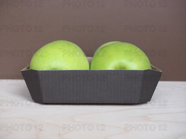 Granny Smith apple fruit food in cardboard basket