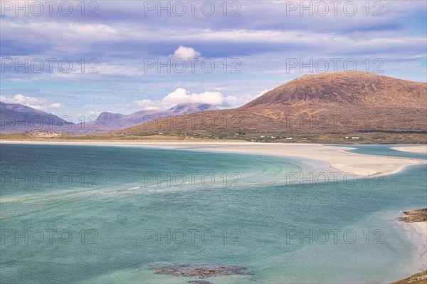 Coastline with sandy beach and mountains