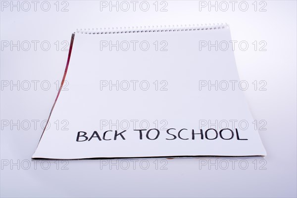 Notebook and back to school title on a notebook