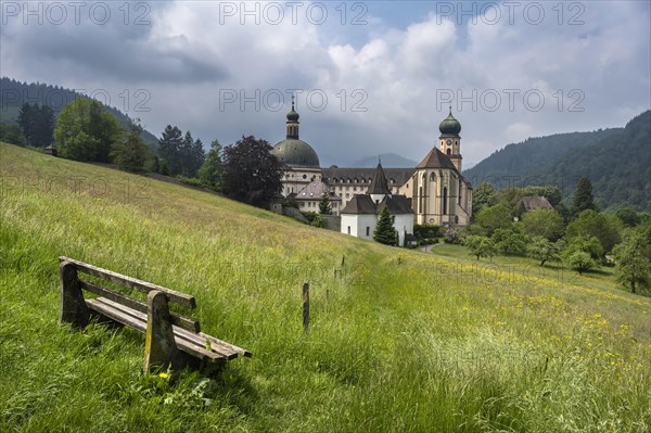 Thunderclouds pass over the Muenstertal and the monastery of Sankt Trudpert