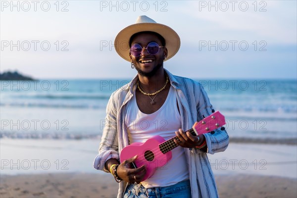 Portrait of black ethnic man enjoy summer vacation on the beach playing ukulele