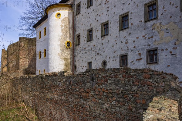 Outer wall of the castle ruins and facade of the castle