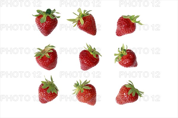 9 cropped fresh fruity strawberries on white background