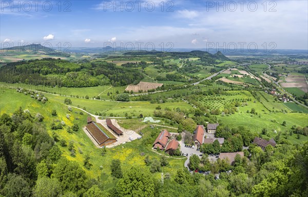 View from Hohentwiel down to the domain on the horizon seen from the right the Hegauberge Hohenkraehen