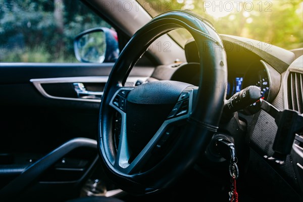 Close-up of the steering wheel of a modern car. View of the steering wheel of a modern car