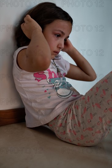 Bored little girl in isolation at home during quarantine COVID 19 Outbreak. Mental health Impact of coronavirus lockdown and social distancing