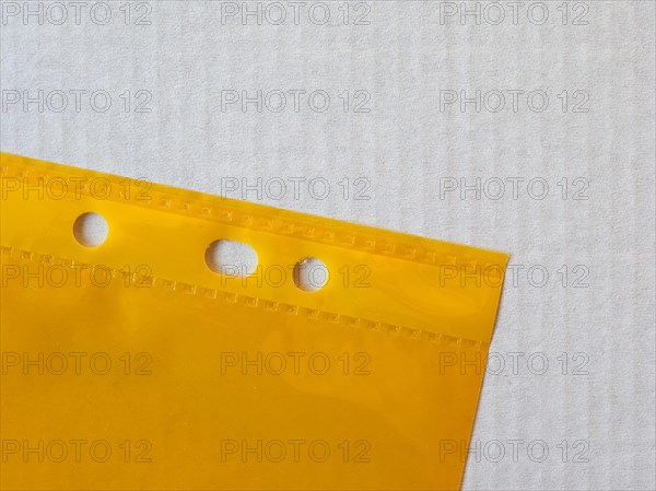 Yellow punched pocket