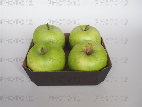 Granny Smith apple fruit food in cardboard basket