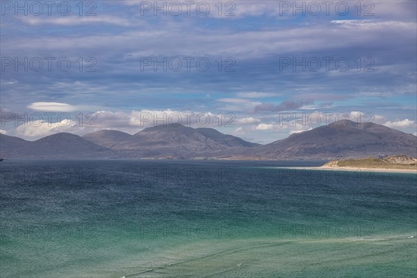 Coastline with sandy beach and mountains