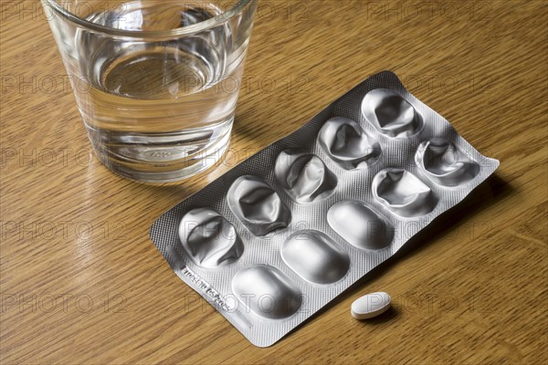 Medicines with a glass of water