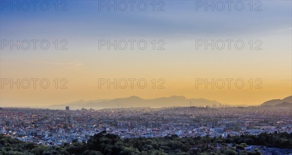 View of Athens and Pireus port from Acropolis hill against sunset