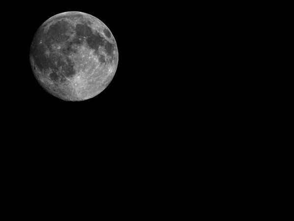 Full moon seen with telescope with copy space