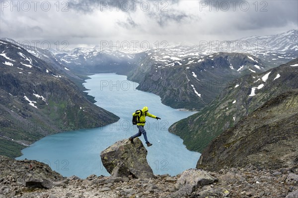 Climber jumps off rocks