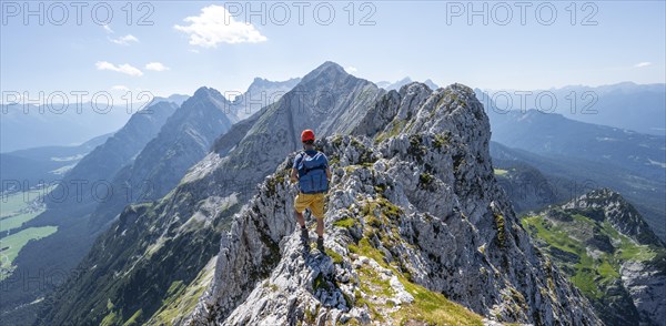 Climbers at the summit of the Upper Wettersteinspitze