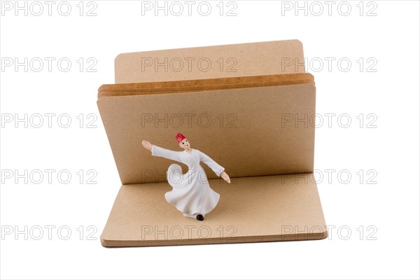 Sufi Dervish on a notebook on white background