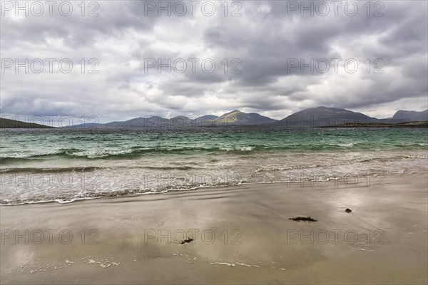 Coastline with sandy beach and mountains