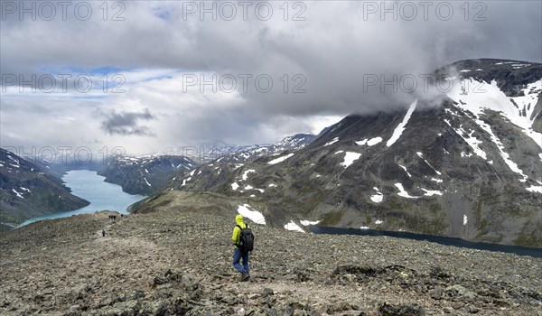 Climbers on stony trail