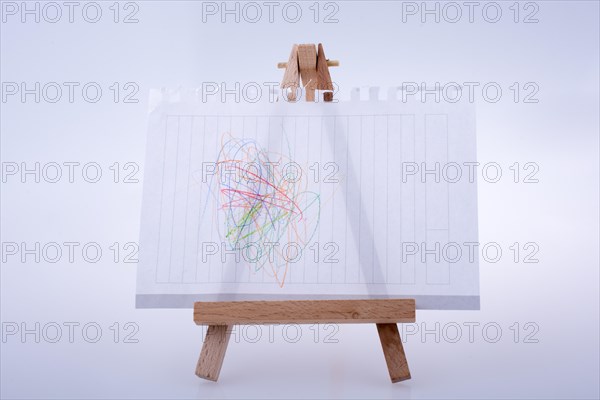 Sheet of white paper put on tripod for painting on white background