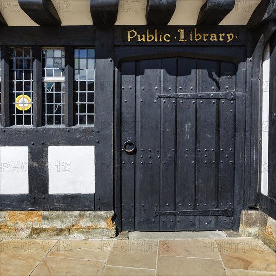 Black wooden door in half-timbered house