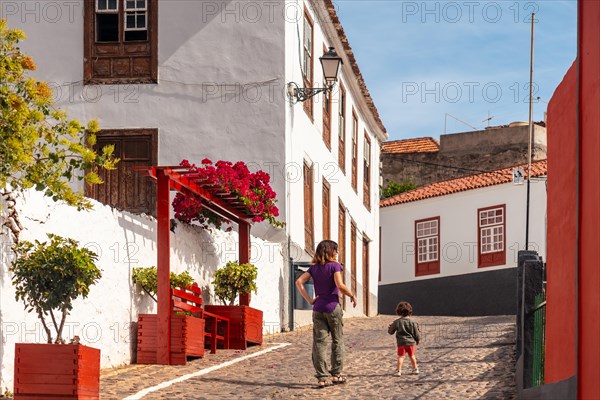 Mother and son visiting the village of Agulo in the north of La Gomera in summer