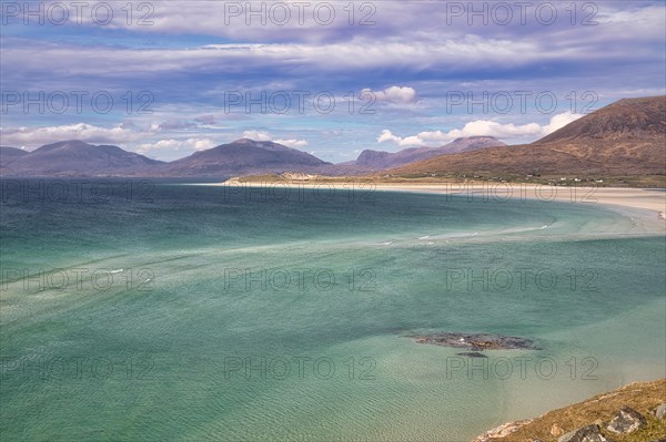 Coastline with sandy beach and mountains