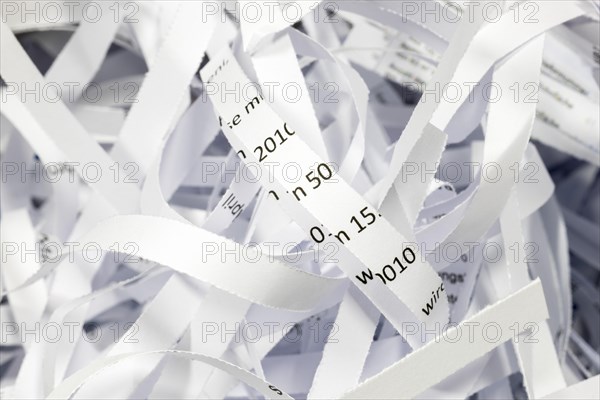 Paper strip documents made unrecognisable in the shredder