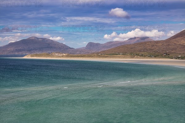 Coastline with sandy beach and mountains