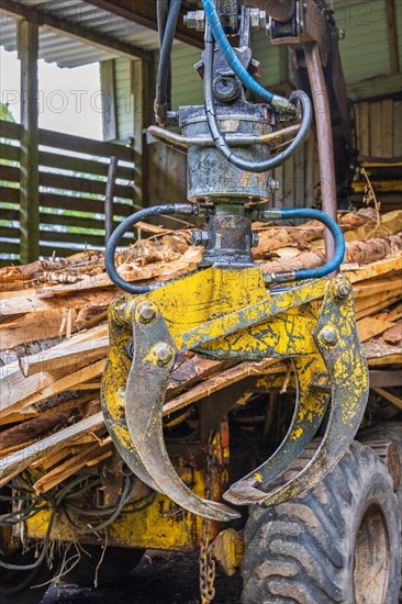 Machine Crane on a forestry vehicle forwarder to lifting logs