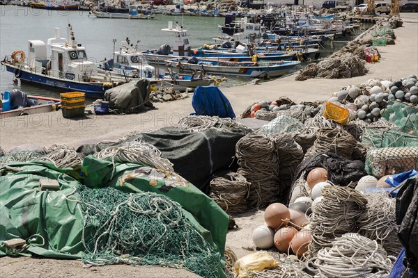 Boat and fishing nets in Gongsuhaean-gil harbour