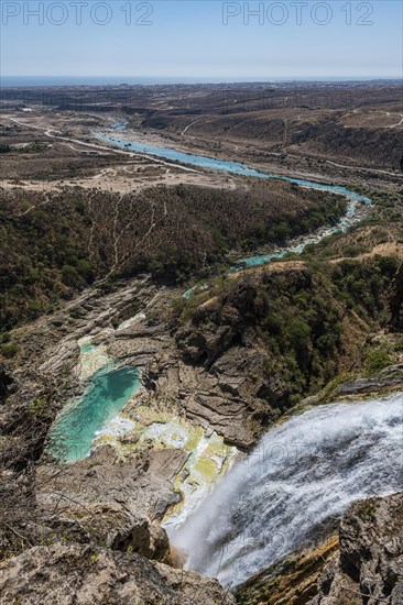 Huge waterfall with turquoise rockpools