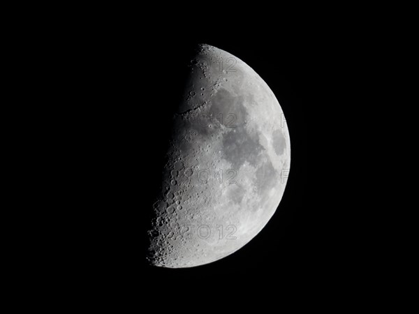 First quarter moon seen with astronomical telescope