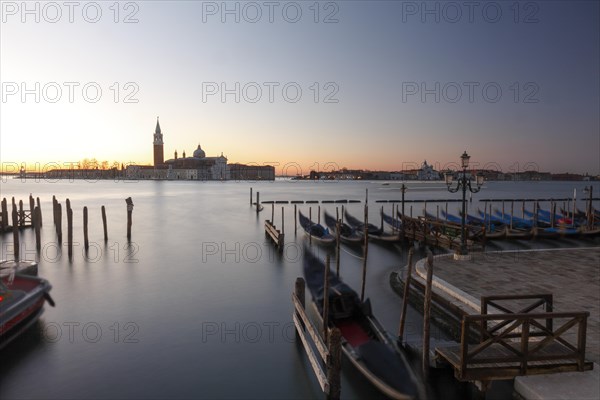 Moored gondolas at the Bacino di San Marco with the church of San Giorgio Maggiore